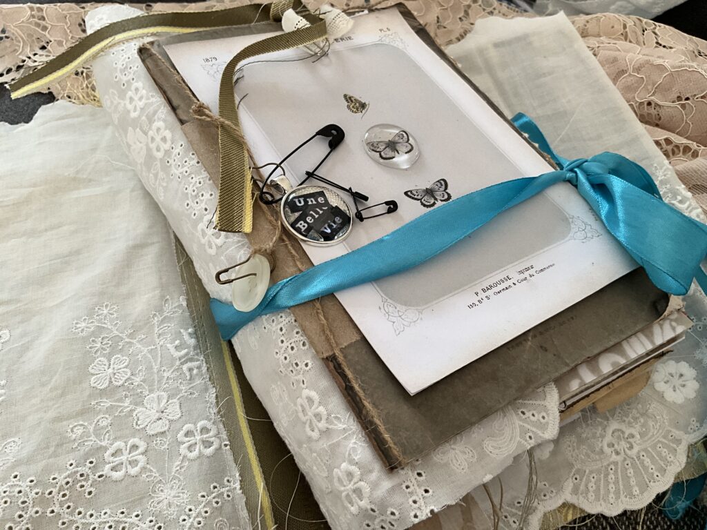 A closed Junk Journal tied wot( teak ribbon